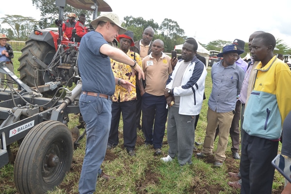 A picture of FMD General Manager Fergus Robley with guests at an event