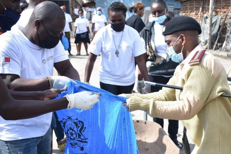 Area Chief Mr. Tsuma Kombo Mangale taking part in the clean up