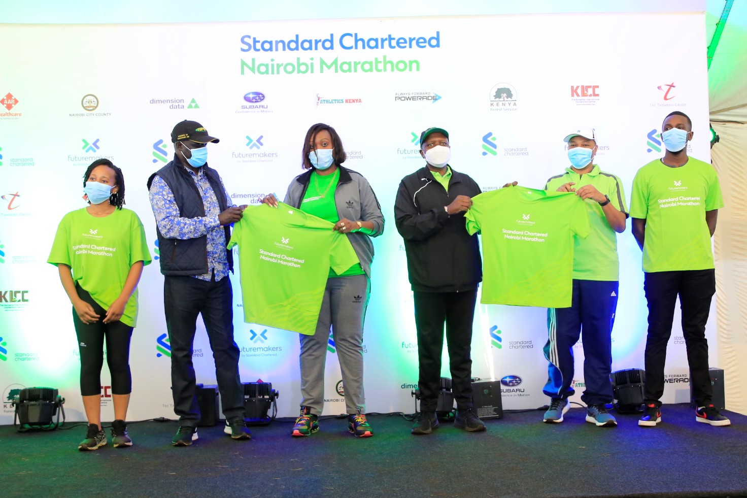 Stakeholder pause for a photo during the launch of Stanchart Marathon