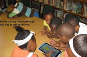 Pupils using tablet in a classroom